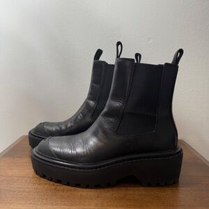 lug-sole Chelsea boots from TORY BURCH featuring jet black, leather, round toe,